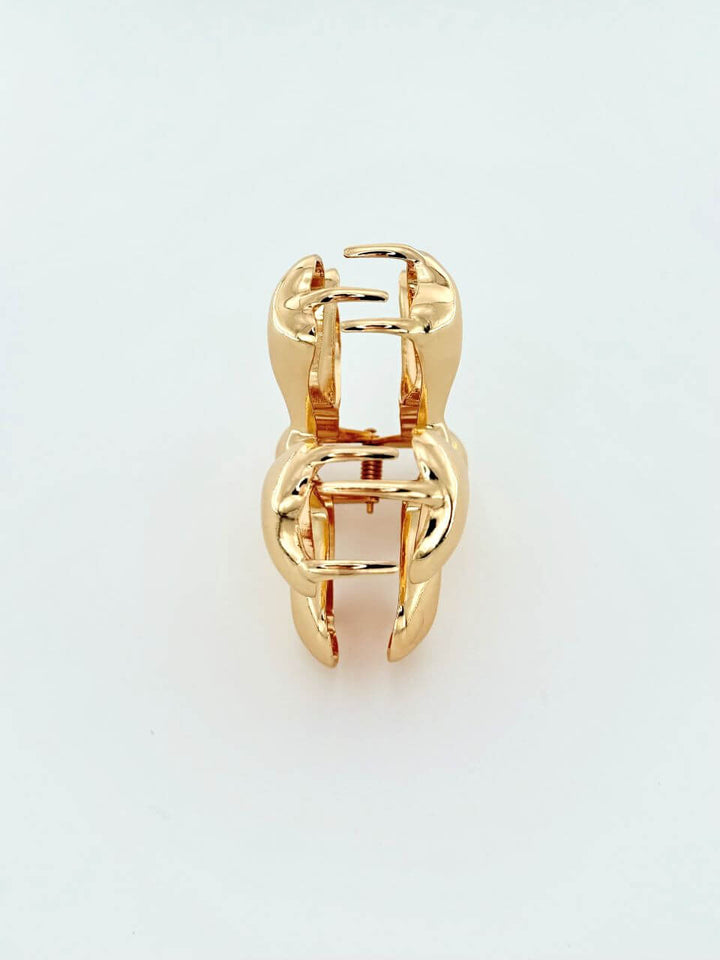 Flower-shaped hair claw in polished gold metal, Luvertta