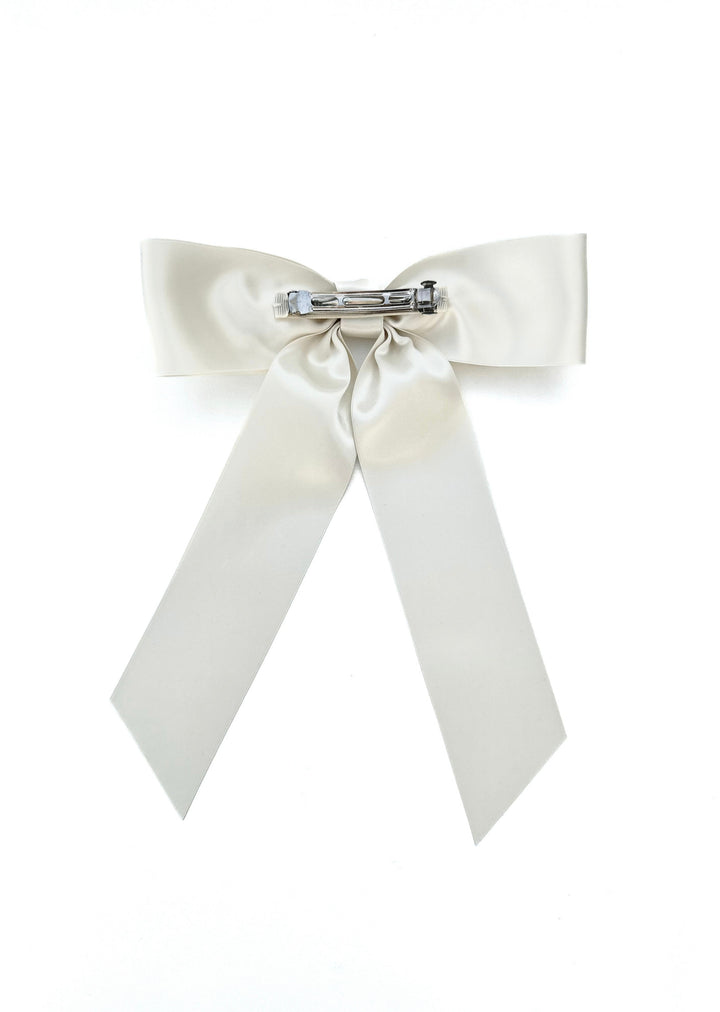 Charlotte hand-tied satin bow barrette in white, Luvertta