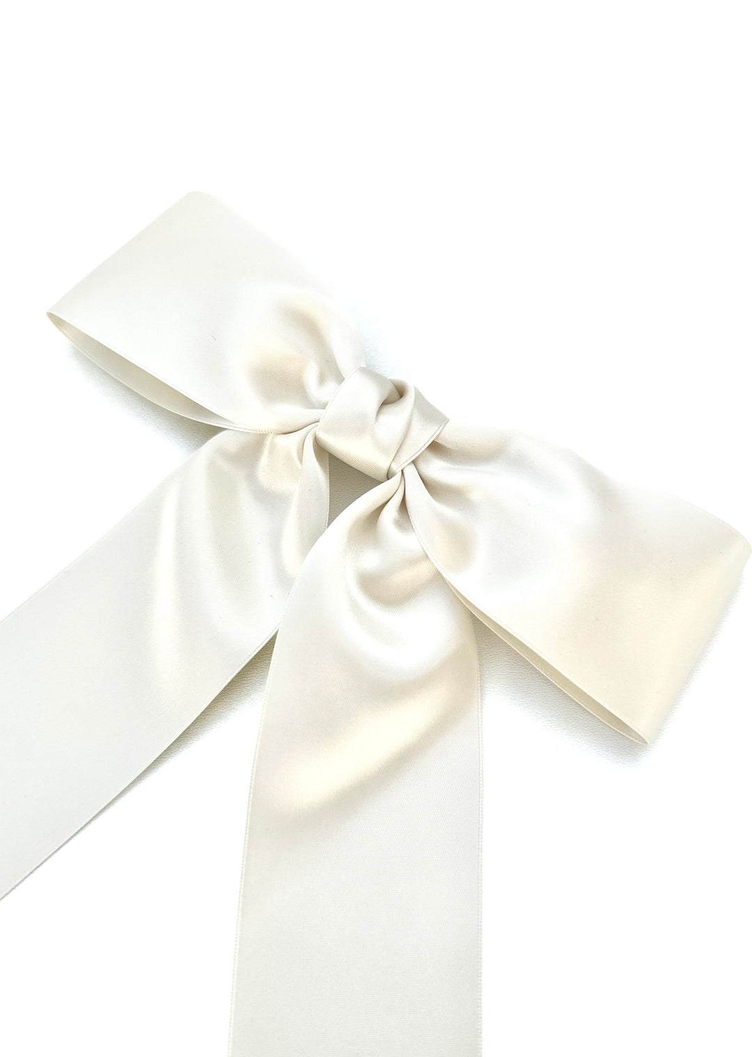 Charlotte hand-tied satin bow barrette in white, Luvertta