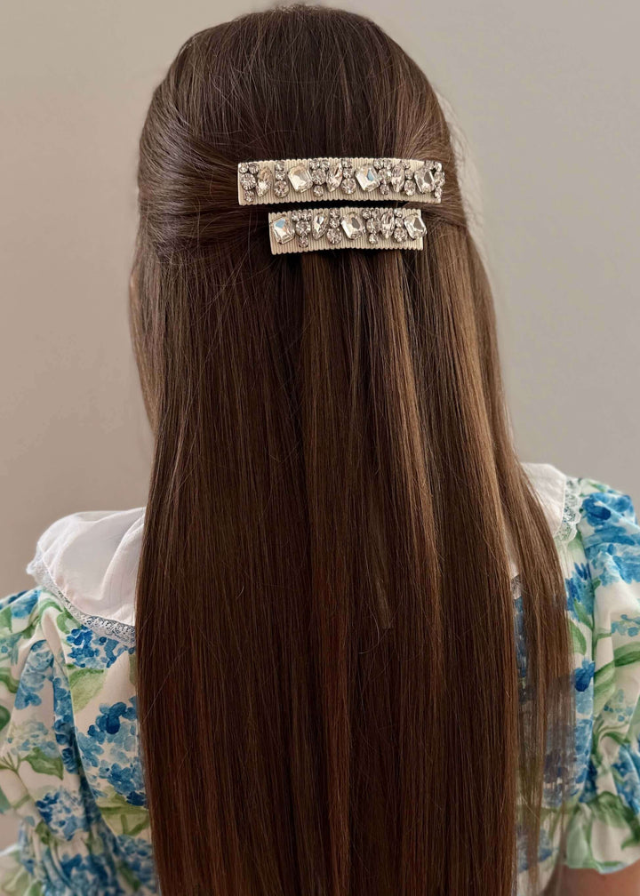 Model wearing Lauren crystal hair barrettes in a half up style, Luvertta